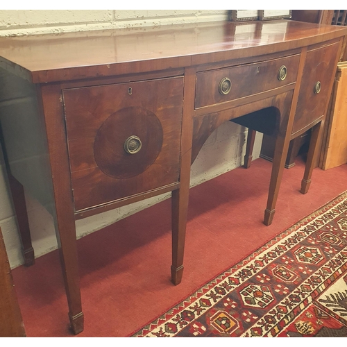 1491 - A 19th Century Mahogany bow fronted Sideboard with single frieze drawer flanked by twin doors on squ... 