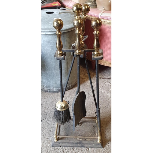 1414 - A good Brass Shower head and mixer tap along with a fire side companion set.