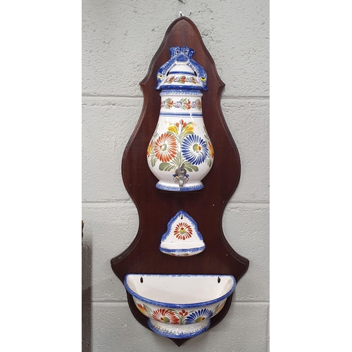 92 - An early 20th Century wall mounted Water Font. H 75 cm approx.