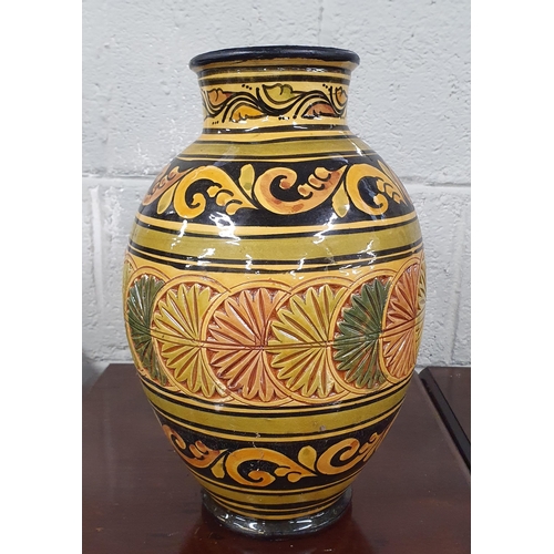 110 - A large bulbous Terracotta Vase with hand painted outline. H 33 cm approx.