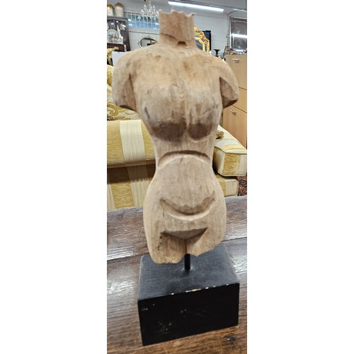 113 - A Timber torso of a female on stand. H 39 cm approx.