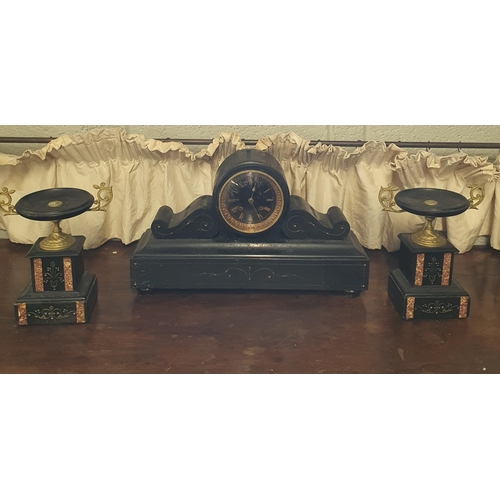 115 - A good 19th Century black slate Garniture consisting of a central clock flanked by two urn shaped ga... 