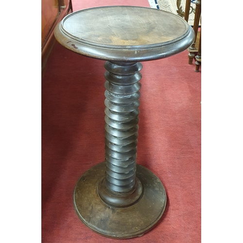 135 - An unusual circular Walnut Lamp Table with platform base. D 34 x H 67 cm approx.