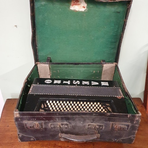 274 - A vintage cased Maestro accordion along with sheet music.