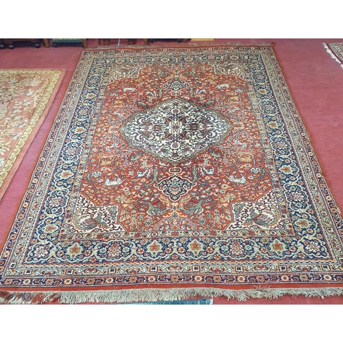 253 - A red and blue ground Carpet with multi borders and unique central medallion design. 290 x 200 cm ap... 