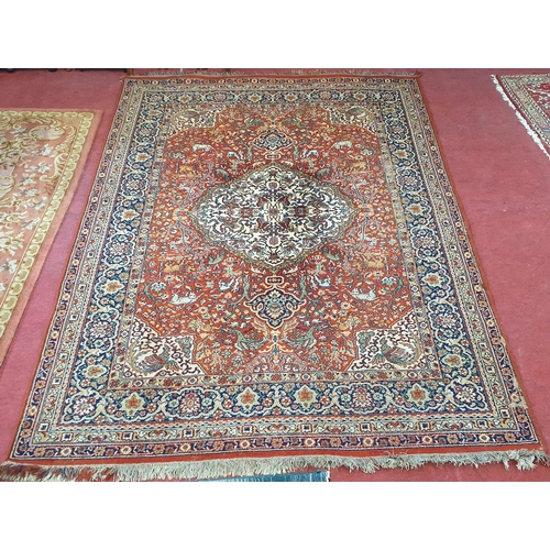 253 - A red and blue ground Carpet with multi borders and unique central medallion design. 290 x 200 cm ap... 