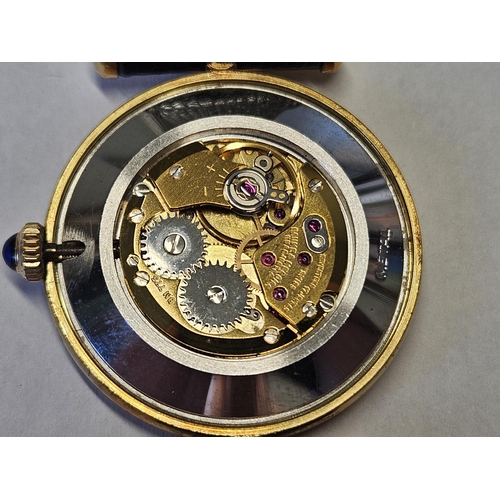 376A - A Baume and Mercier Watch in an 18k Gold Case, stamped 18k on the interior of the watch.