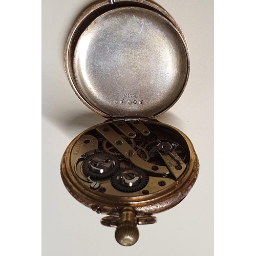 375 - An 18ct Gold fob Watch with a highly etched outline seems to be keeping good time.