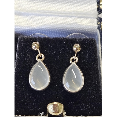 395 - A apir of White Gold and moonstone Earrings.