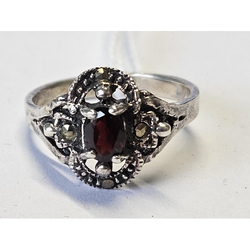 392 - A Silver, Marcasite and Garnet Ring, size M1/2.