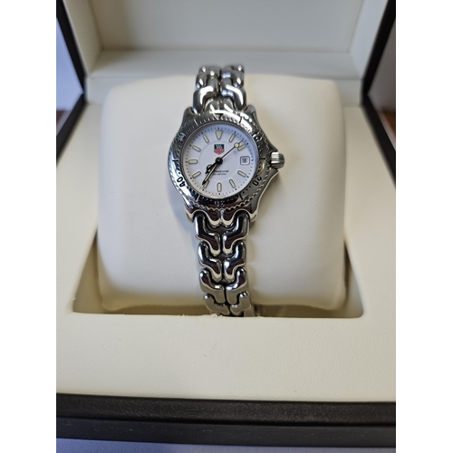 382 - A ladies Tag Heuer Watch in original box, seems to be keeping good time.