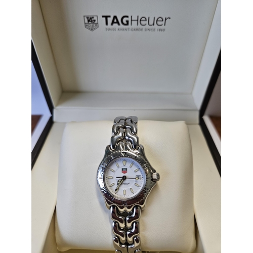 382 - A ladies Tag Heuer Watch in original box, seems to be keeping good time.