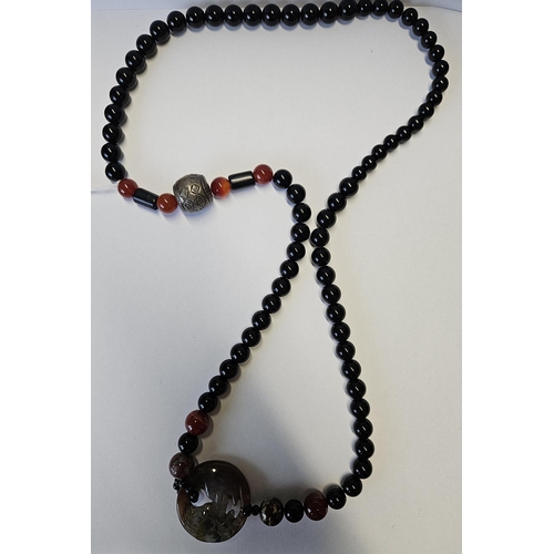 380 - A Chinese Silver and Agate Necklace.