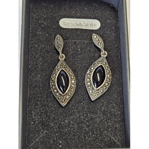 417 - A pair of Silver Marcasite and Onyx drop Earrings.