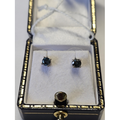 404 - A pair of White Gold, Diamond and Sapphire Earrings.