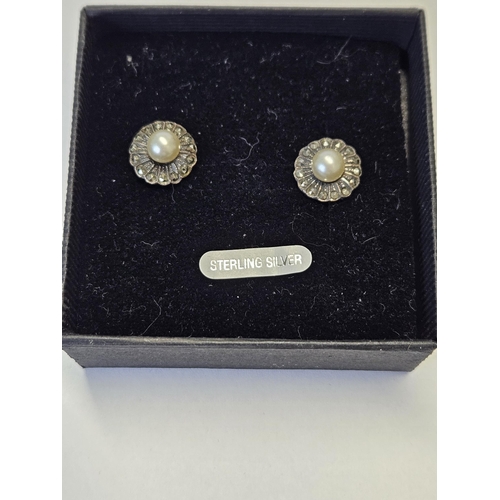 403 - A pair of Silver, Marcasite and Pearl Earrings.