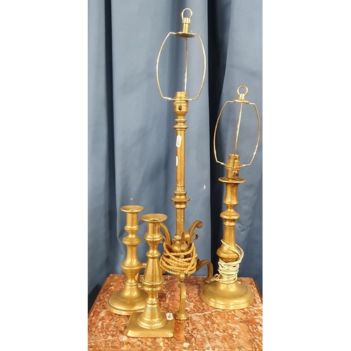 452 - A good quantity of 19th Century and later Candlesticks and Table Lamps.