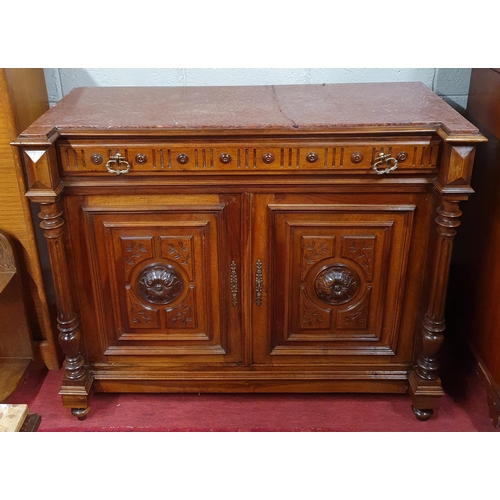 469 - A 19th Century Walnut two door Side Cabinet with single frieze drawer and highly carved and fielded ... 