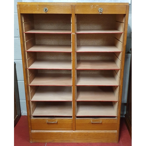 468 - A 20th Century Oak and veneered double fronted Filing Cabinet with fall down tambour doors.
 80 x 35... 