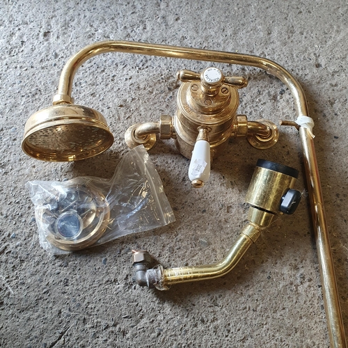 1414 - A good Brass Shower head and mixer tap along with a fire side companion set.