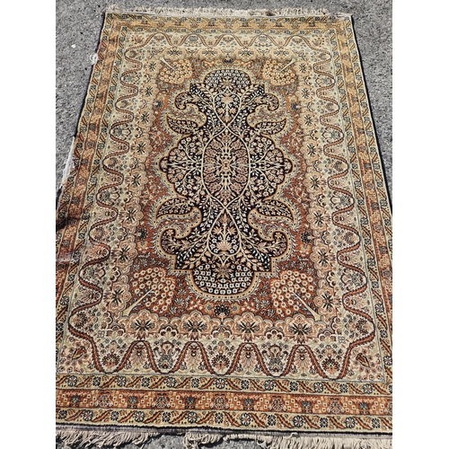 1450 - A brown ground Carpet with multi borders and central medallion design along with another with the sa... 