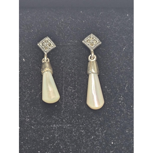 407 - A pair of Silver, Marcasite and Mother of Pearl Earrings.