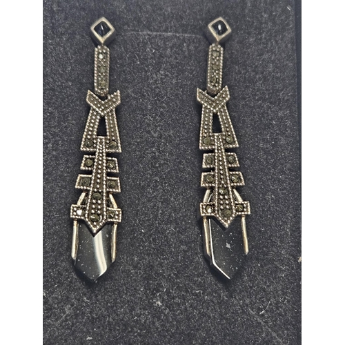 409 - A pair of Silver, Onyx and Marcasite drop Earrings.