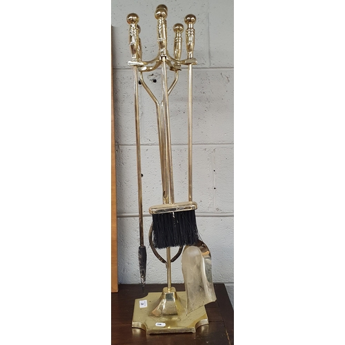 26 - A Brass Companion Set along with two log bins. 
H 180 x W 20 cm approx.