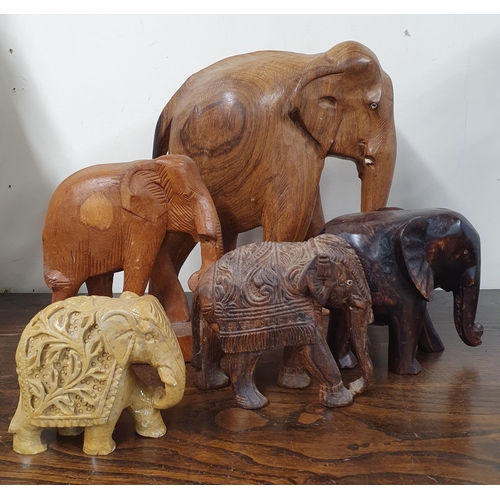 45 - A quantity of Carved Hardwood Elephants. 
Largest H 30 x 37 cm approx.