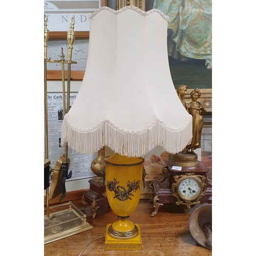 59 - A Good Metal Urn Shaped Table Lamp with shade along with a pricket stand. H74 x D 40 cm approx.