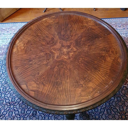 262 - An early 20th Century Walnut circular Centre Table with tray top and highly carved pierced outline. ... 