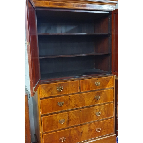 106 - An Edwardian and Mahogany Inlaid Gentleman's Wardrobe with twin door top above a bank of graduated d... 