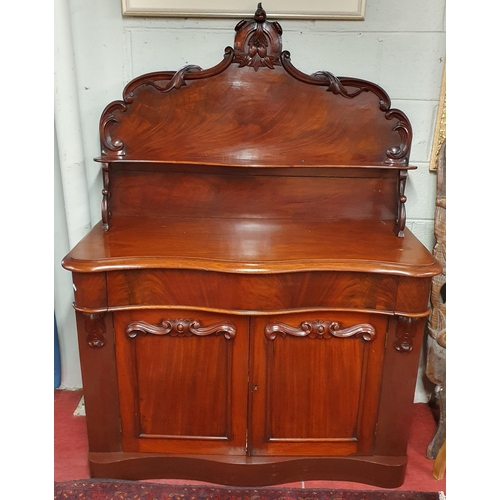 119 - A 19th Century Mahogany Chiffonier with serpentine outline and highly carved panel doors.
W 120 x D ... 