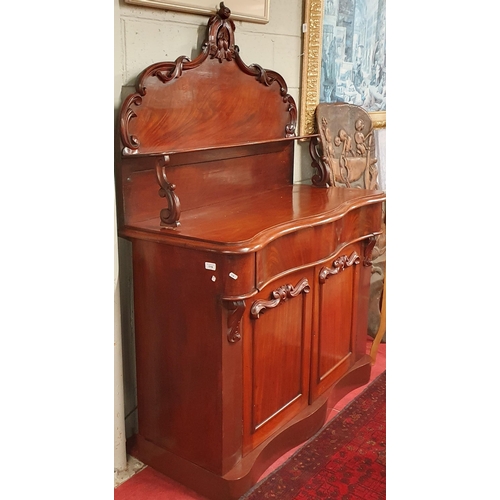 119 - A 19th Century Mahogany Chiffonier with serpentine outline and highly carved panel doors.
W 120 x D ... 