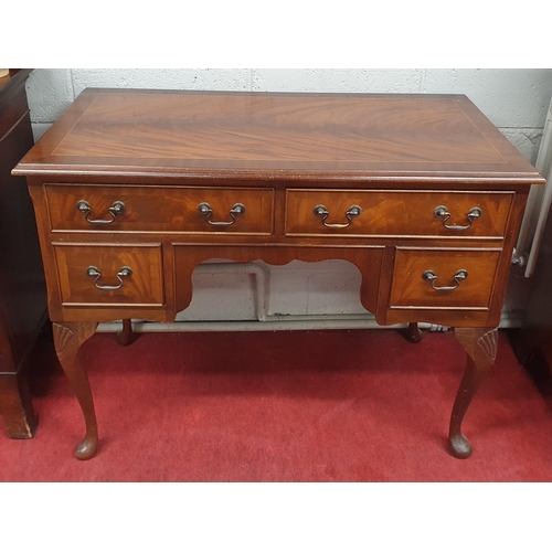 169 - A reproduction neat Mahogany Side Table/Desk on carved cabriole supports. W 99 x 51 x H 76 cm approx... 