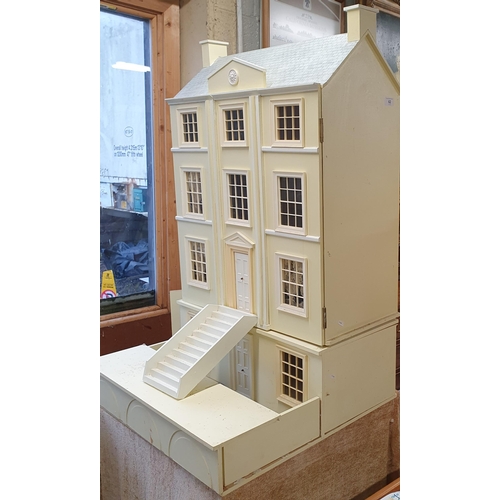 62 - A good Scratch Built Dolls House on table base. 
H 100 x D 64 x W 64 cm approx.