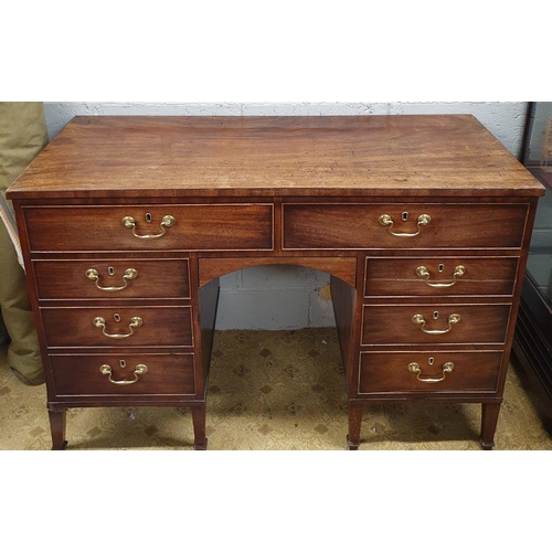 67 - A Georgian Mahogany Side Cabinet with twin frieze drawers over triple drawers with kneehole centre o... 