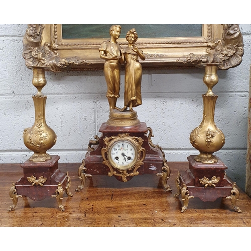 72 - A Superb 19th Century Clock Garniture Set depicting a loving couple flanked by a pair of garnitures.... 