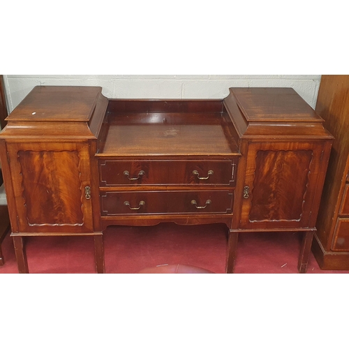 96 - A 19th Century Mahogany Side Board with pedestal style sides and flanking, twin drawer centre and sq... 