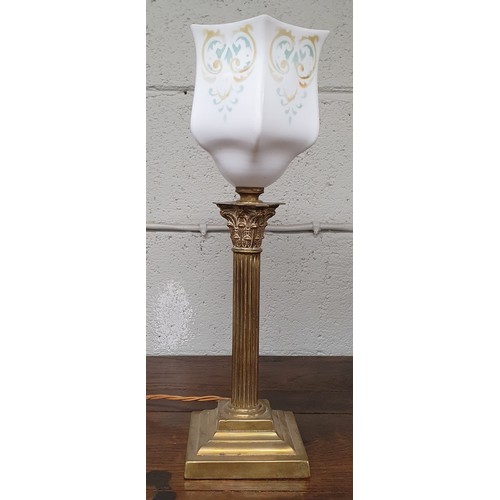 19 - An early 20th Century Brass Corinthian column Table Lamp with painted cloudy glass shade, overall he... 