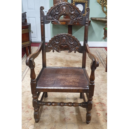 574 - An early 19th possibly 18th Century Oak Bishops Chair with highly carved back on turned supports and... 