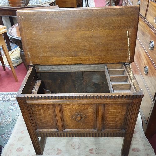 194 - An early 20th Century Oak Miniature Blanket Chest with drop leaf and highly carved front.
W 78 x D 4... 