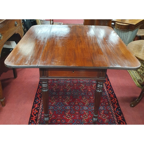 250 - Of Superb Quality. A 19th Century Mahogany Side Table with drop leaves on turned columned supports w... 