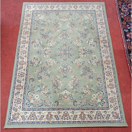 261 - A green ground Carpet with repeating central design.
169 x 120 cm approx.