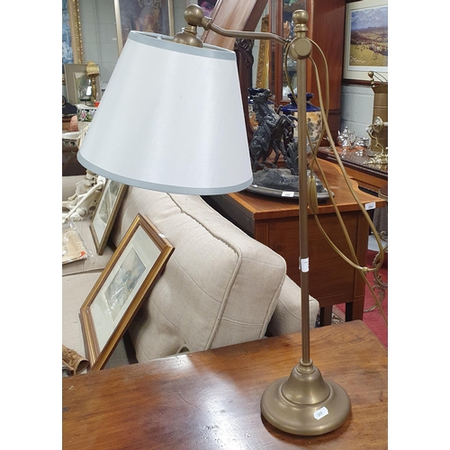 283 - A good heavy Brass reading Lamp with an adjustable top.
H 64 cm approx.