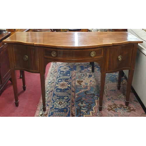 284 - An Edwardian and Mahogany inlaid serpentine fronted Sideboard with single frieze drawer flanked by t... 