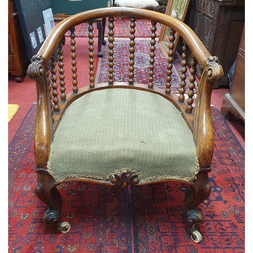 370 - Of Superb quality. An early 19th Century solid Rosewood Tub Chair of neat proportions with bobbin tu... 