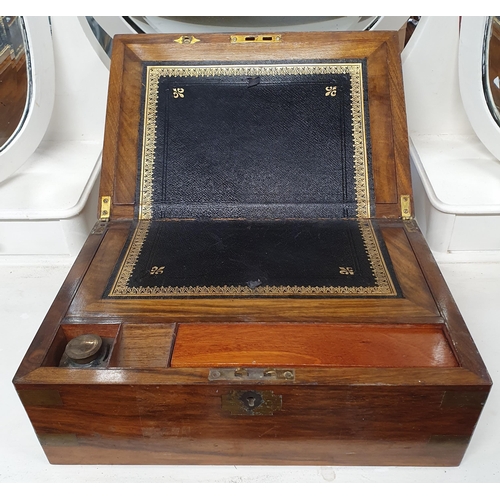 507 - A 19th Century Walnut Campaign Writing Slope with leather insert.
H 16 x W 35 x D 24 cm approx.