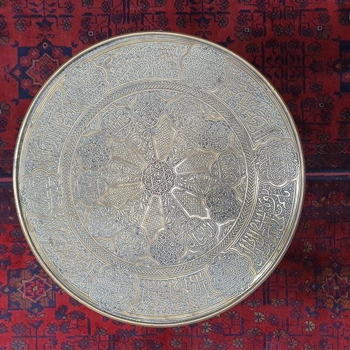 512 - A 20th Century fold up Table with brass top. H 47 x D 45 cm approx.