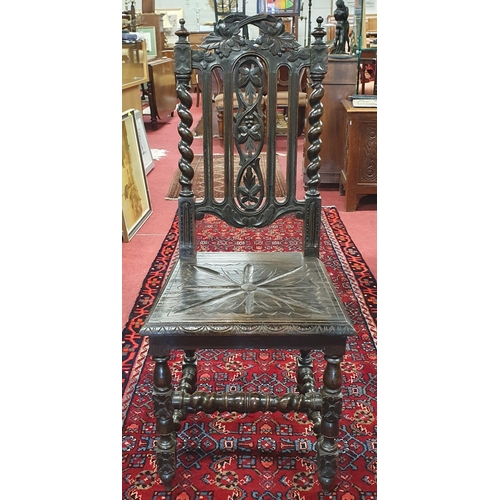 514 - A 19th Century Oak hall Chair with highly pierced back on turned supports.
BH 108 x W 45 x D 42 cm a... 